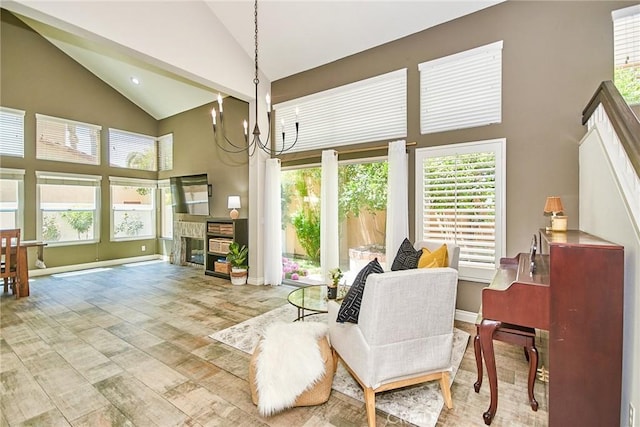 19 Las Cruces, Irvine, CA 92614 - dining space with high vaulted ceiling, a chandelier, wood finished floors, and a stone fireplace