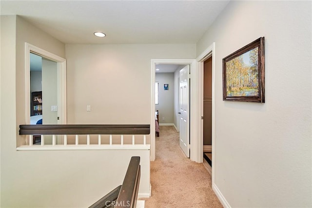 19 Las Cruces, Irvine, CA 92614 - corridor featuring light colored carpet, an upstairs landing, and recessed lighting