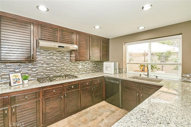 19 Las Cruces, Irvine, CA 92614 - kitchen with dishwasher, stainless steel gas stovetop, under cabinet range hood, tasteful backsplash, and recessed lighting