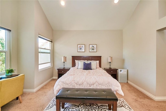 19 Las Cruces, Irvine, CA 92614 - bedroom featuring light carpet, multiple windows, lofted ceiling, and recessed lighting