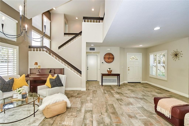 19 Las Cruces, Irvine, CA 92614 - entryway with wood finished floors, stairway, recessed lighting, and a towering ceiling