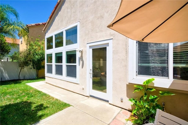 19 Las Cruces, Irvine, CA 92614 - entrance to property with stucco siding and a patio area