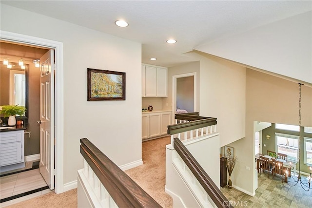 19 Las Cruces, Irvine, CA 92614 - hallway with an upstairs landing, light colored carpet, and recessed lighting