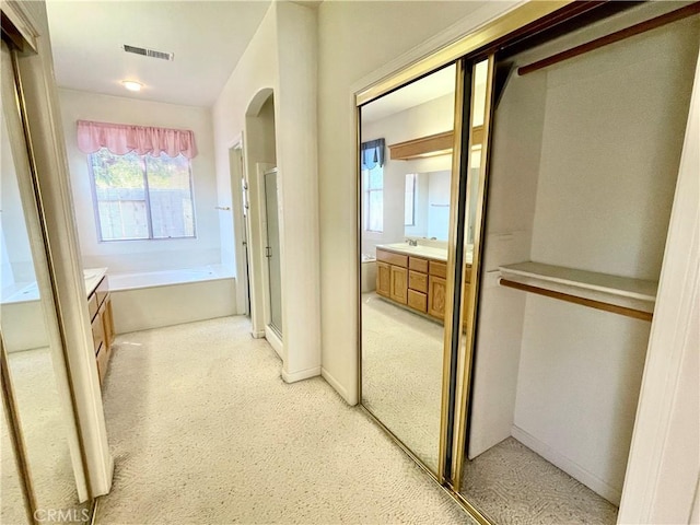 224 Stonewood Dr, Los Banos, CA 93635 - full bathroom featuring vanity, a stall shower, a bath, and carpet floors