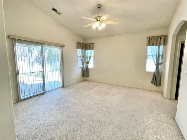 224 Stonewood Dr, Los Banos, CA 93635 - empty room with lofted ceiling, a ceiling fan, carpet, and arched walkways