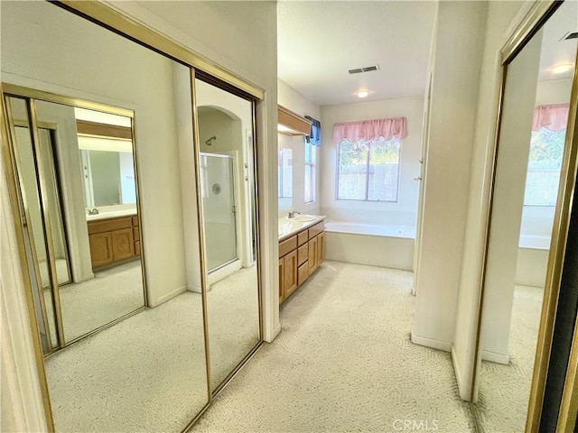 224 Stonewood Dr, Los Banos, CA 93635 - full bath featuring a shower stall, a bath, vanity, and carpet floors