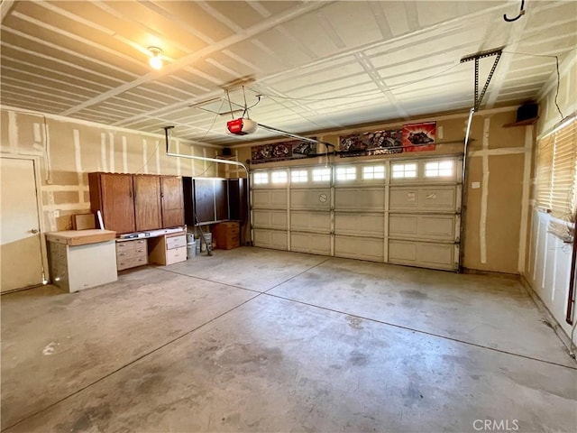 224 Stonewood Dr, Los Banos, CA 93635 - garage featuring a garage door opener