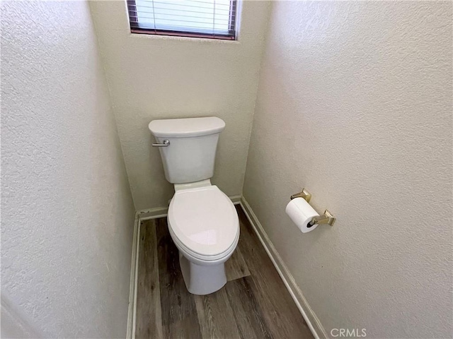 224 Stonewood Dr, Los Banos, CA 93635 - bathroom with toilet and wood finished floors
