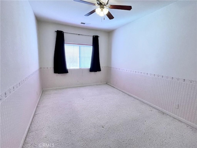 224 Stonewood Dr, Los Banos, CA 93635 - carpeted empty room featuring ceiling fan and wainscoting