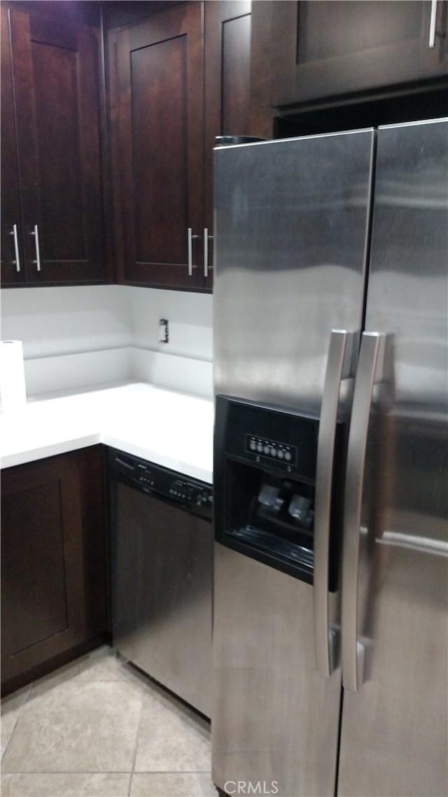545 Chestnut Ave Unit 207, Long Beach, CA 90802 - kitchen featuring stainless steel appliances, light countertops, dark brown cabinetry, and light tile patterned floors