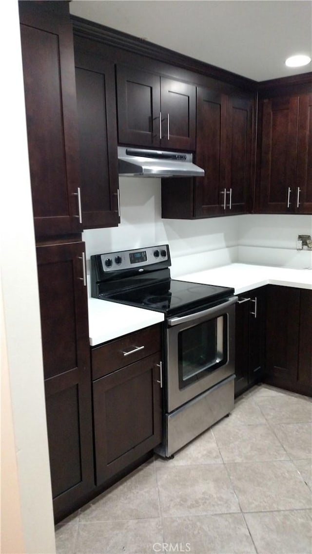 545 Chestnut Ave Unit 207, Long Beach, CA 90802 - kitchen with under cabinet range hood, stainless steel electric stove, light countertops, and light tile patterned floors