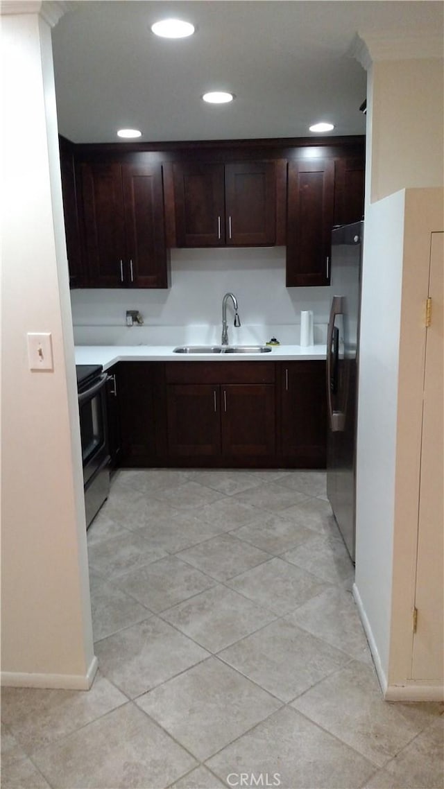545 Chestnut Ave Unit 207, Long Beach, CA 90802 - kitchen featuring freestanding refrigerator, black / electric stove, light countertops, dark brown cabinetry, and recessed lighting