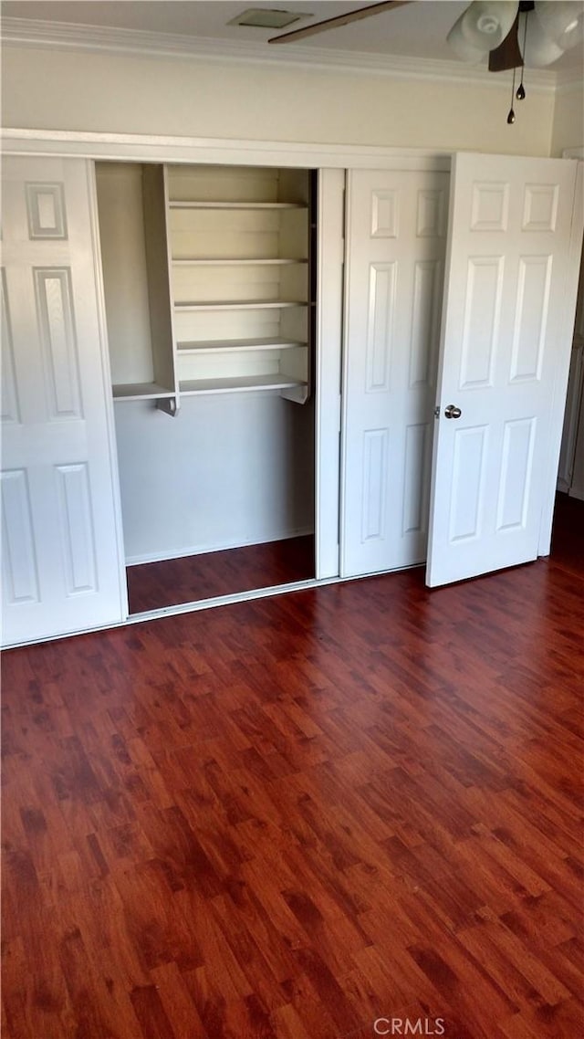 545 Chestnut Ave Unit 207, Long Beach, CA 90802 - unfurnished bedroom with crown molding, dark wood-style floors, a closet, and ceiling fan