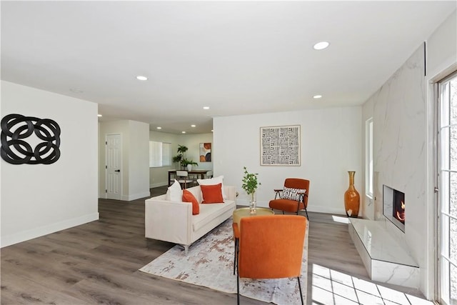 15615 Erie Rd, Apple Valley, CA 92307 - living room with recessed lighting, healthy amount of natural light, wood finished floors, and a fireplace