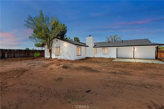 15615 Erie Rd, Apple Valley, CA 92307 - rear view of house featuring a chimney