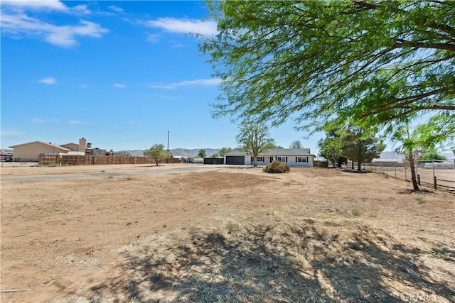 15615 Erie Rd, Apple Valley, CA 92307 - view of yard featuring a garage
