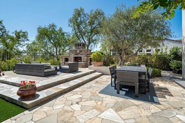7425 Rancho Cabrillo Trl, San Diego, CA 92127 - view of patio / terrace with outdoor dining area and an outdoor living space with a fireplace