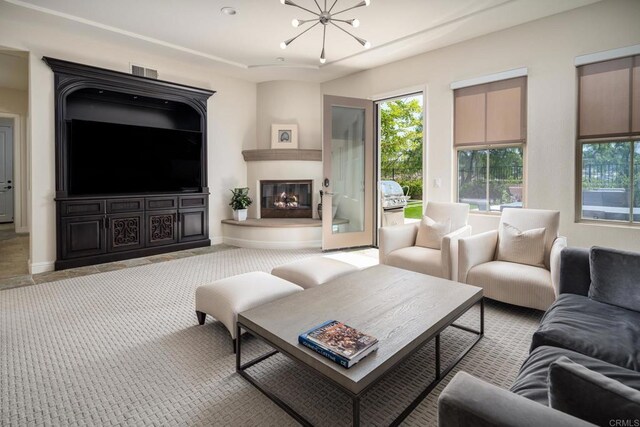 7425 Rancho Cabrillo Trl, San Diego, CA 92127 - living area with a chandelier, a large fireplace, and carpet