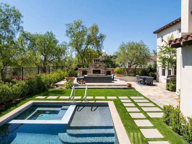7425 Rancho Cabrillo Trl, San Diego, CA 92127 - view of swimming pool featuring an outdoor stone fireplace, a patio area, an in-ground hot tub, and a fenced backyard