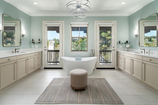 7425 Rancho Cabrillo Trl, San Diego, CA 92127 - bathroom with healthy amount of natural light, two vanities, a freestanding bath, tile patterned flooring, and recessed lighting