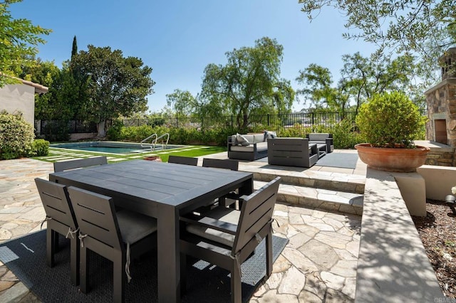 7425 Rancho Cabrillo Trl, San Diego, CA 92127 - fenced backyard featuring a patio, outdoor dining space, and an outdoor hangout area