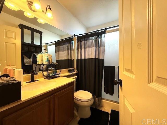 911 Concord Ct, Vista, CA 92081 - bathroom featuring vanity and a shower with curtain