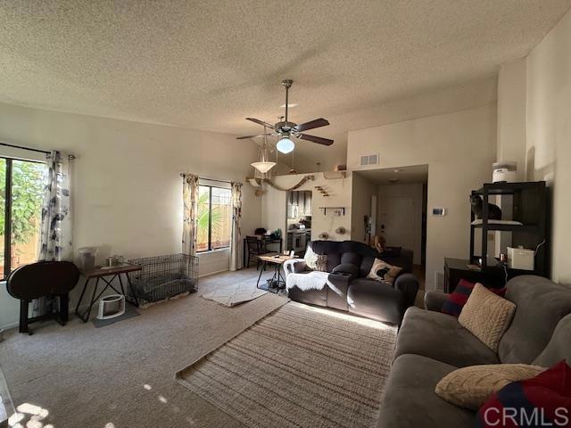 911 Concord Ct, Vista, CA 92081 - living area with a textured ceiling, ceiling fan, and carpet flooring