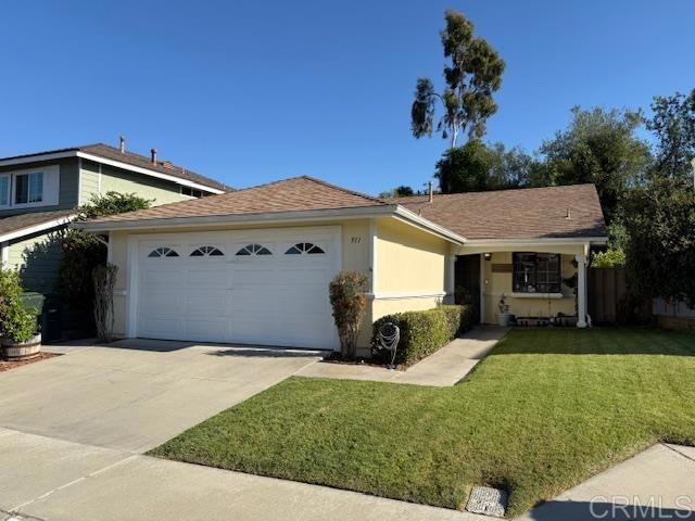 911 Concord Ct, Vista, CA 92081 - single story home with an attached garage, concrete driveway, and a front yard