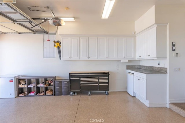 11645 Wiggins Ct, Yucaipa, CA 92399 - garage featuring a garage door opener and baseboards
