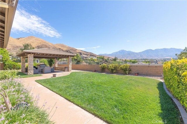 11645 Wiggins Ct, Yucaipa, CA 92399 - fenced backyard with a gazebo, a mountain view, outdoor lounge area, and a patio