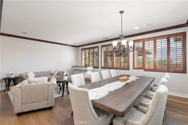 11645 Wiggins Ct, Yucaipa, CA 92399 - dining area with a chandelier, ornamental molding, and light wood-style floors