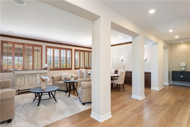 11645 Wiggins Ct, Yucaipa, CA 92399 - living room with light wood-style flooring, healthy amount of natural light, recessed lighting, and ornamental molding