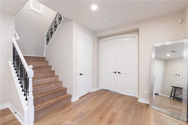 11645 Wiggins Ct, Yucaipa, CA 92399 - staircase with wood finished floors and recessed lighting