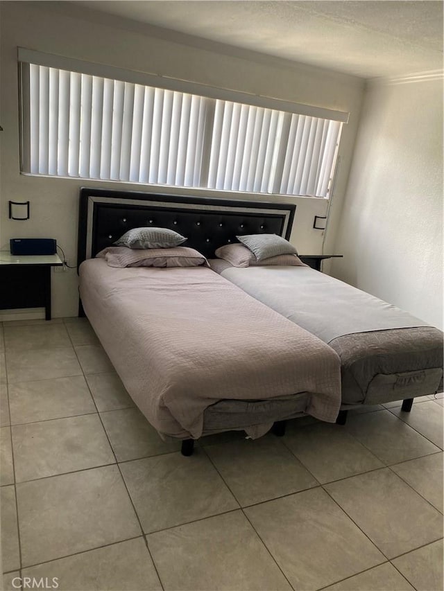 427 W 92nd St, Los Angeles, CA 90003 - bedroom featuring light tile patterned flooring