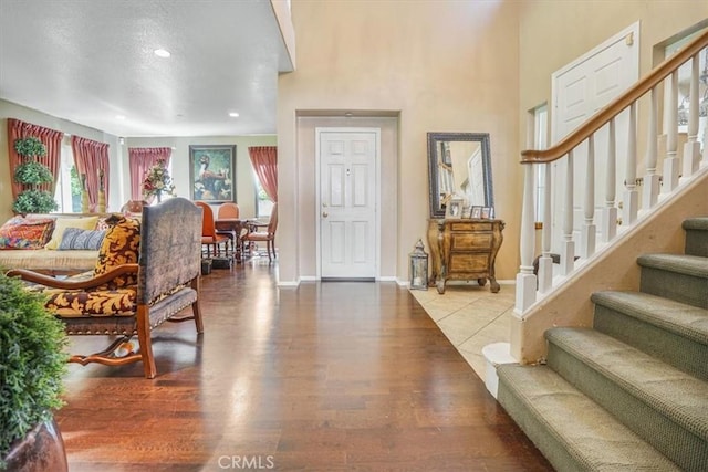 57 Mountain Laurel Way, Azusa, CA 91702 - entryway featuring stairway, wood finished floors, a high ceiling, and recessed lighting