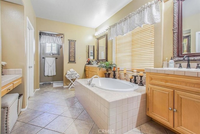 57 Mountain Laurel Way, Azusa, CA 91702 - full bathroom featuring a bath, two vanities, and tile patterned flooring