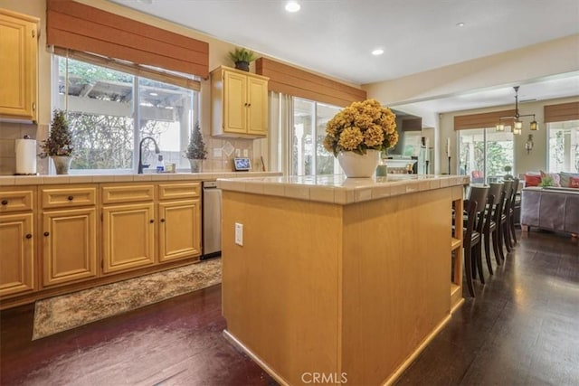 57 Mountain Laurel Way, Azusa, CA 91702 - kitchen with tile countertops, recessed lighting, dark wood-style floors, backsplash, and a kitchen island