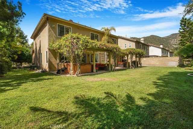 57 Mountain Laurel Way, Azusa, CA 91702 - rear view of property with a jacuzzi, stucco siding, and a mountain view