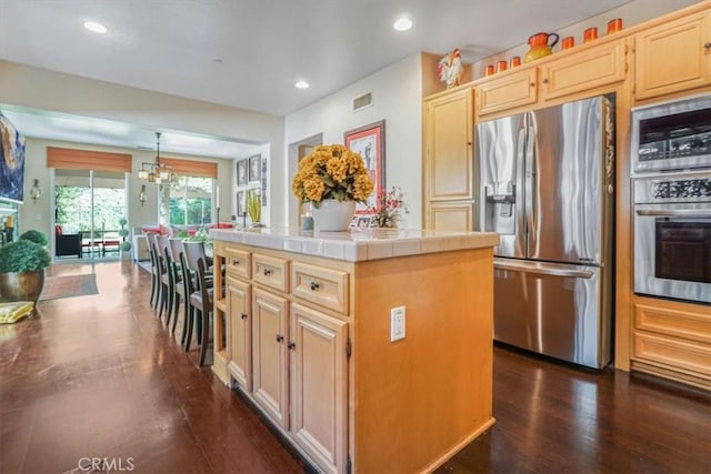 57 Mountain Laurel Way, Azusa, CA 91702 - kitchen featuring appliances with stainless steel finishes, tile countertops, light brown cabinets, dark wood finished floors, and recessed lighting