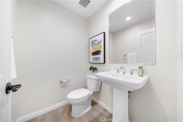 2437 Sanabria Ln, Brea, CA 92821 - bathroom with toilet and wood finished floors