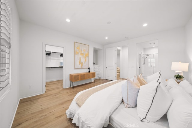2437 Sanabria Ln, Brea, CA 92821 - bedroom featuring light wood finished floors, a spacious closet, recessed lighting, and connected bathroom