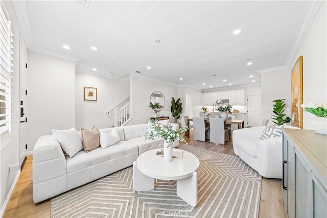 2437 Sanabria Ln, Brea, CA 92821 - living room featuring stairway, recessed lighting, light wood-type flooring, and ornamental molding