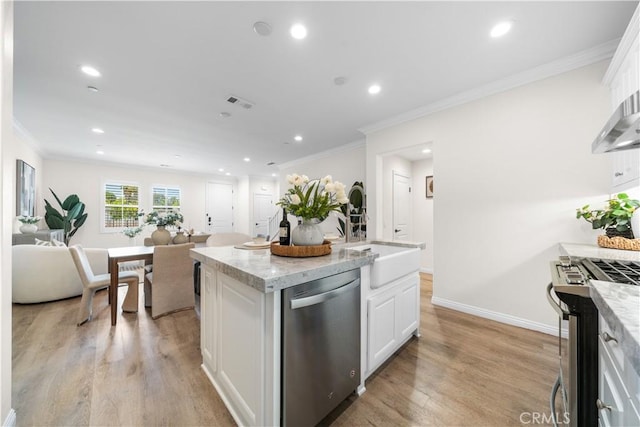 2437 Sanabria Ln, Brea, CA 92821 - kitchen with appliances with stainless steel finishes, light wood-style flooring, white cabinets, open floor plan, and recessed lighting