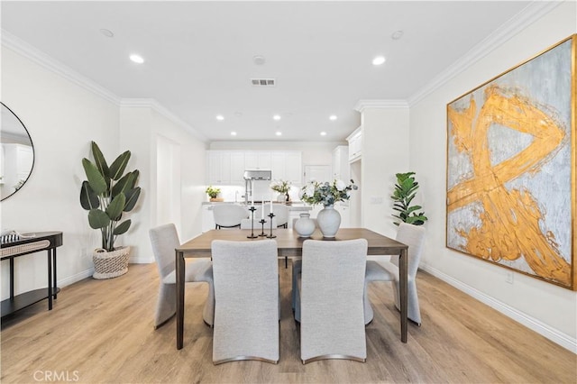 2437 Sanabria Ln, Brea, CA 92821 - dining room featuring light wood-type flooring, recessed lighting, and ornamental molding