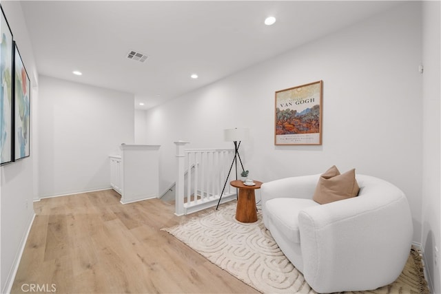 2437 Sanabria Ln, Brea, CA 92821 - sitting room featuring an upstairs landing, recessed lighting, and light wood-style flooring
