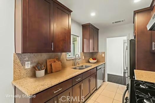 4775 Beverly Ct, Riverside, CA 92506 - kitchen with stainless steel appliances, light countertops, backsplash, dark brown cabinetry, and recessed lighting