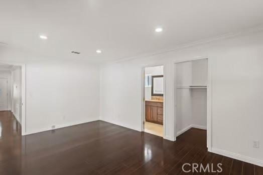 4775 Beverly Ct, Riverside, CA 92506 - unfurnished bedroom featuring wood finished floors, recessed lighting, connected bathroom, and ornamental molding