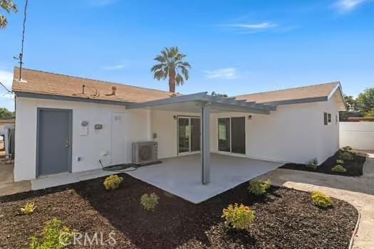 4775 Beverly Ct, Riverside, CA 92506 - rear view of property featuring a patio area, stucco siding, and a pergola
