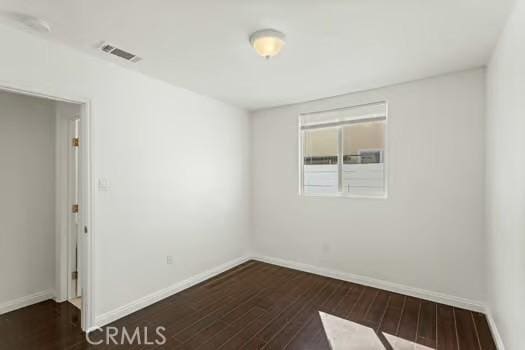 4775 Beverly Ct, Riverside, CA 92506 - spare room featuring dark wood-type flooring and baseboards