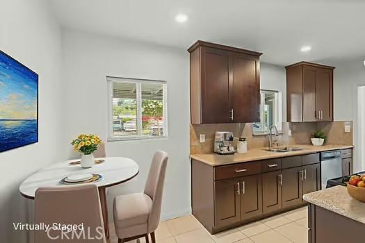 4775 Beverly Ct, Riverside, CA 92506 - kitchen with light countertops, dark brown cabinetry, recessed lighting, dishwasher, and light tile patterned flooring